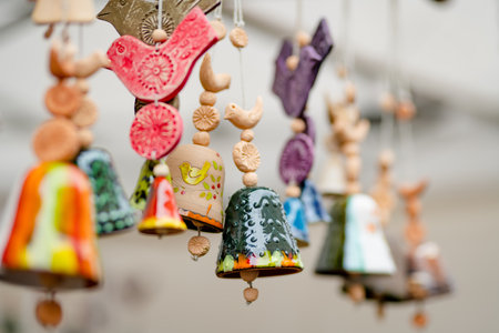 Colorful ceramic bells and other decorations sold on Easter market in Vilnius. Lithuanian capital's annual traditional crafts fair is held every March on Old Town streets.の写真素材
