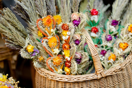 Traditional Lithuanian Easter palms known as verbos sold on Kaziukas, Easter market in Vilnius. Lithuanian capital's annual traditional crafts fair is held every March on Old Town streets.の写真素材