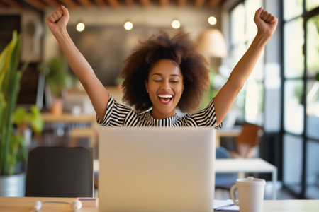 Excited young woman looking at laptop screen. Beautiful overjoyed girl feeling happy about her work. Generative AI.の素材