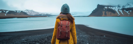 Young female hiker with a backpack admiring scenic view of spectacular Icelandic nature on a sunset. Breathtaking landscape of Iceland. Hiking by foot. Generative AI.の素材
