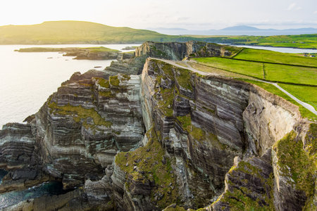 Amazing wave lashed Kerry Cliffs, widely accepted as the most spectacular cliffs in County Kerry, Ireland. Tourist attractions on famous Ring of Kerry route.の写真素材