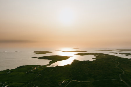 Spectacular sunset view of Ardmore and Turbot islands from famous scenic Sky Road, 15km looped drive starting in Clifden with numerous brilliant viewing points, Wild Atlantic Way, Connemara, Ireland.の写真素材
