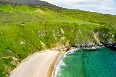 Silver Strand, a sandy beach in a sheltered, horseshoe-shaped bay, situated at Malin Beg, near Glencolmcille, in south-west County Donegal. Wild Atlantic Way, spectacular coastal route in Ireland.の写真素材