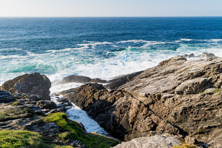 Rough and rocky shore at Malin Head, Ireland's northernmost point, Wild Atlantic Way, spectacular coastal route. Wonders of nature. Numerous Discovery Points. Co. Donegalの写真素材