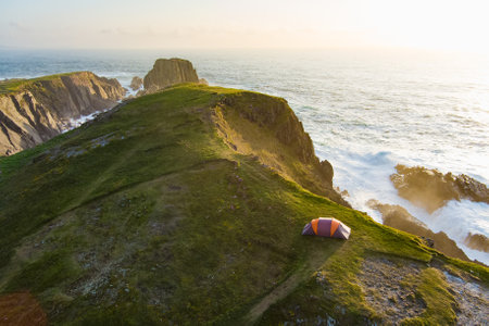 Camping tent on the cliff at Scheildren, most iconic and photographed landscape at Malin Head, Wild Atlantic Way, spectacular coastal route. Wonders of nature. Numerous Discovery Points. Co. Donegalの写真素材