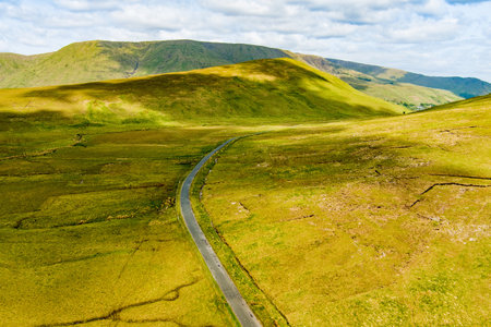 Beautiful aerial sunset view of Connemara region in Ireland. Scenic Irish countryside landscape with magnificent mountains on the horizon, County Galway, Ireland.の写真素材
