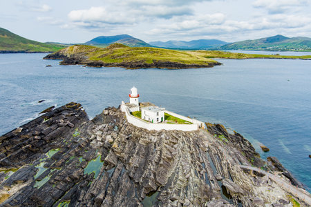 Beautiful aerial view of Valentia Island Lighthouse at Cromwell Point. Locations worth visiting on the Wild Atlantic Way. Scenic Irish countyside on sunny summer day, County Kerry, Ireland.の写真素材