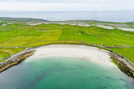 Aerial view of the wide sandy Kilmurvey Beach on Inishmore, the largest of the Aran Islands in Galway Bay, Ireland.の写真素材