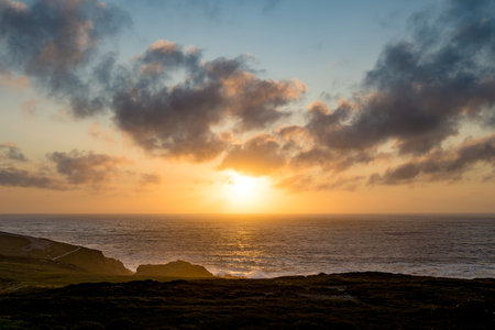 Sun setting at Malin Head, Ireland's northernmost point, Wild Atlantic Way, spectacular coastal route. Wonders of nature. Numerous Discovery Points. Co. Donegalの写真素材