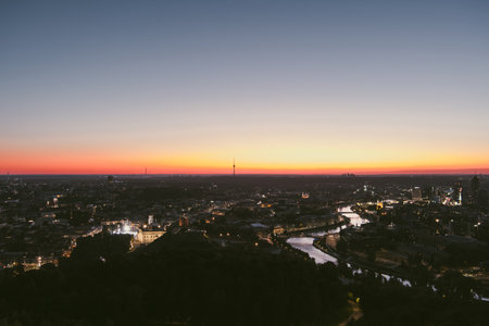 Scenic aerial view of Vilnius Old Town and Neris river at nightfall. Sunset landscape. Night view of Vilnius, Lithuania.の写真素材