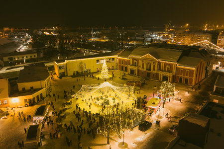 Nighttime aerial view of decorated and illuminated Christmas tree on the Teatro Square in Klaipeda. Celebrating Christmas and New Year in coastal city of Klaipeda, Lithuania.の写真素材