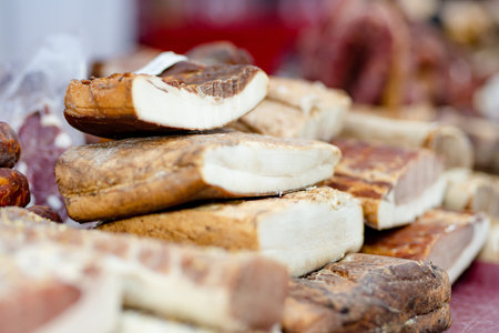Selection of assorted home made meats, jerky and sausages on a farmers market in Vilnius, Lithuania. Kaziukas, traditional spring fair in capital of Lithuania.の写真素材