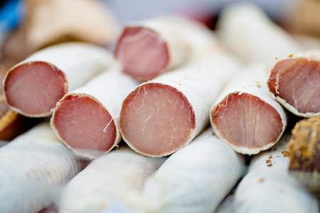 Selection of assorted home made meats, jerky and sausages on a farmers market in Vilnius, Lithuania. Kaziukas, traditional spring fair in capital of Lithuania.の写真素材