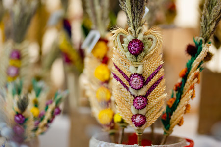 Traditional Lithuanian Easter palms known as verbos sold on Kaziukas, Easter market in Vilnius. Lithuanian capital's annual traditional crafts fair is held every March on Old Town streets.の写真素材