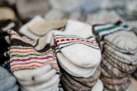 Colorful warm knitted socks sold on Easter market in Vilnius. Annual spring fair held in March on the streets of capital of Lithuania.の写真素材