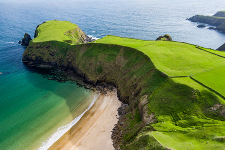 Silver Strand, a sandy beach in a sheltered, horseshoe-shaped bay, situated at Malin Beg, near Glencolmcille, in south-west County Donegal. Wild Atlantic Way, spectacular coastal route in Ireland.の写真素材