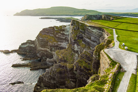 Amazing wave lashed Kerry Cliffs, widely accepted as the most spectacular cliffs in County Kerry, Ireland. Tourist attractions on famous Ring of Kerry route.の写真素材