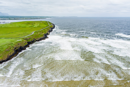 Spectacular Tullan Strand, one of Donegal's renowned surf beaches, framed by a scenic back drop provided by the Sligo-Leitrim Mountains. Wide flat sandy beach in County Donegal, Ireland.の写真素材