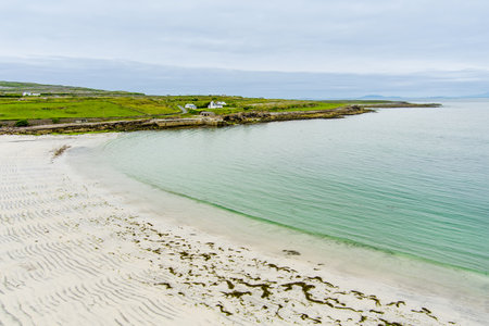 Aerial view of the wide sandy Kilmurvey Beach on Inishmore, the largest of the Aran Islands in Galway Bay, Ireland.の写真素材