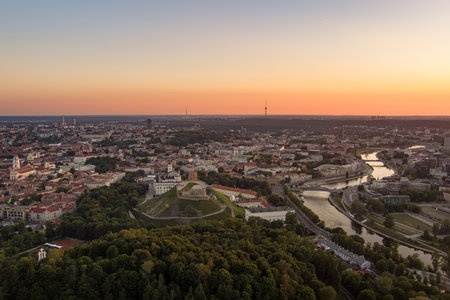 Scenic aerial view of Vilnius Old Town and Neris river at nightfall. Sunset landscape. Night view of Vilnius, Lithuania.の写真素材