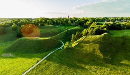 Aerial view of Kernave Archaeological site, a medieval capital of the Grand Duchy of Lithuania, tourist attraction and UNESCO World Heritage Site. Sunny summer evening.の写真素材