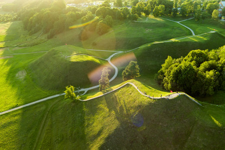 Aerial view of Kernave Archaeological site, a medieval capital of the Grand Duchy of Lithuania, tourist attraction and UNESCO World Heritage Site. Sunny summer evening.の写真素材