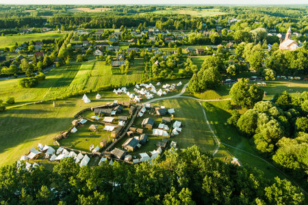 Aerial view of Kernave Archaeological site, a medieval capital of the Grand Duchy of Lithuania, tourist attraction and UNESCO World Heritage Site. Sunny summer evening.の写真素材
