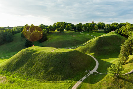 Aerial view of Kernave Archaeological site, a medieval capital of the Grand Duchy of Lithuania, tourist attraction and UNESCO World Heritage Site. Sunny summer evening.の写真素材