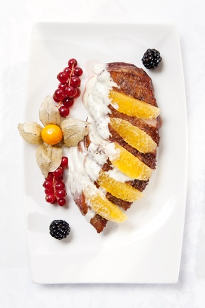 Roasted duck breast fillet with orange and berries の写真素材