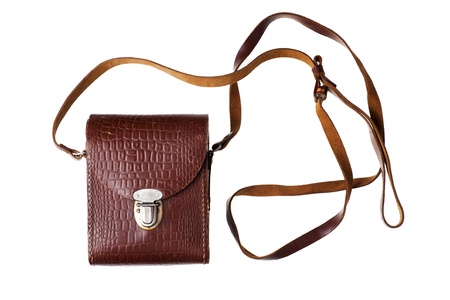 Old camera in leather case, isolated on whiteの写真素材