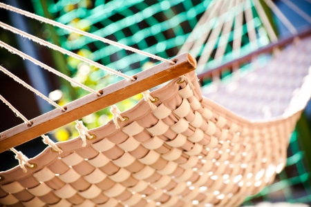 Hammock hanging in the sunny yard, close up photo の写真素材