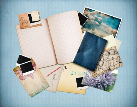 Vintage background with old paper, cards and instant photos, blue paper at background の写真素材