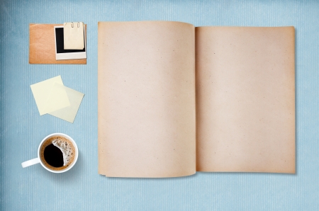Coffee cup, note paper and notebook, vintage blue paper on backgroundの写真素材