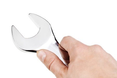 Wrench in the man's hand, isolated on whiteの写真素材
