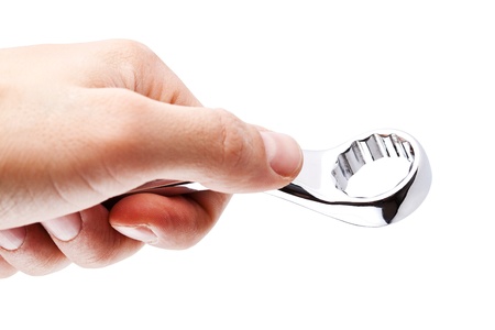 Wrench in the man's hand, isolated on whiteの写真素材