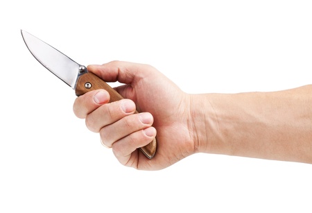 Knife in hand, isolated on white backgroundの写真素材