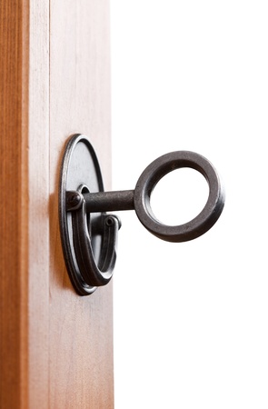 Old key in lockの写真素材