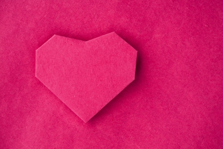 Hand made paper heart on kraft paper as background. Greeting car. Free space for textの写真素材