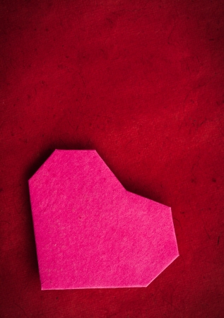 Hand made paper heart on kraft paper as background. Greeting car. Free space for textの写真素材