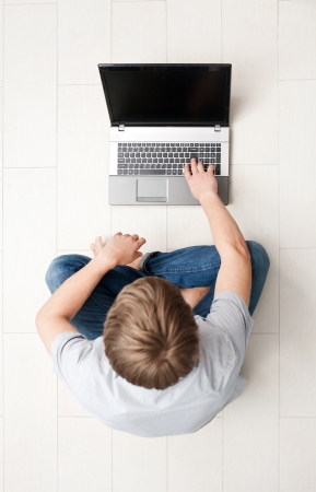 Man working on the laptop at home の写真素材
