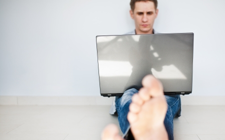Man working on the laptop at homeの写真素材