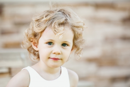 Adorable little girl taken closeup outdoors in summerの写真素材