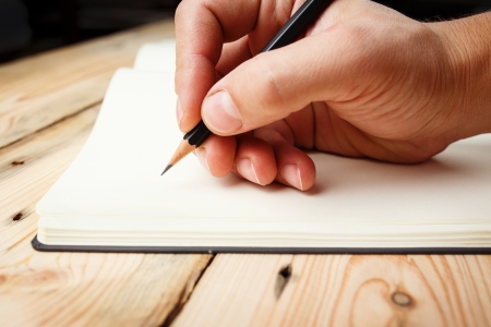 In Search Of Inspiration. A man with an empty notebook. の写真素材