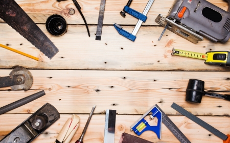 Kit of construction tools and instruments on wood texture background の写真素材