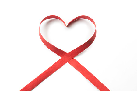Red heart ribbon, on white background の写真素材