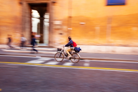 Cyclist on the city roadway. Rome, Italyの写真素材