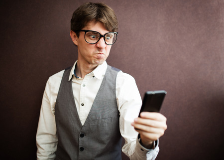 Angry man with mobile smartphone