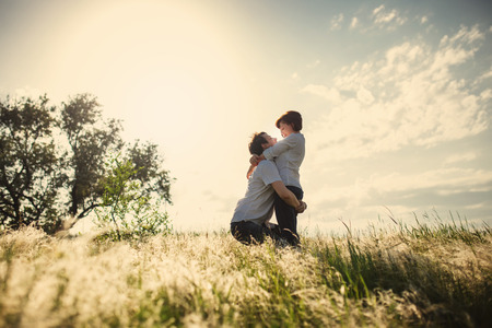 Happy couple outdoor, summertime, tinted photoの写真素材