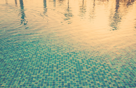 Water surface background in outdoor pool near sea, tinted photoの写真素材