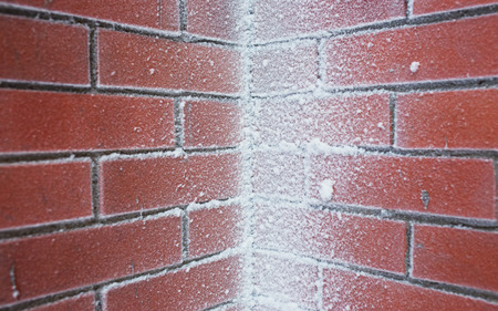 Snow Covered Brick Wall closeupの写真素材